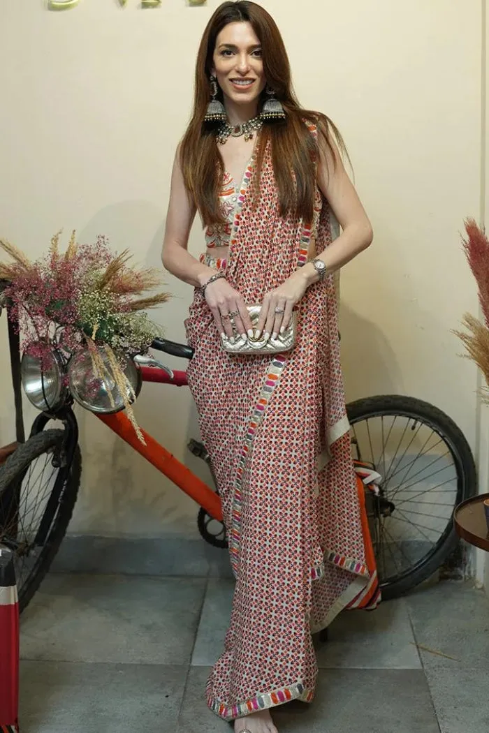 IVORY GEOMETRIC PRINT PRE STITCHED CASCASE SAREE TEAMED WITH AN EMBELLISHED BUSTIER